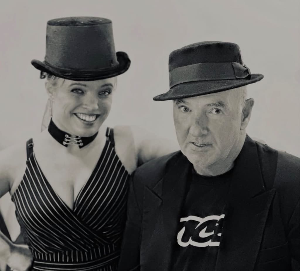 The Zach & Lyndsey Show official theatrical portrait: Lyndsey Hawkes with top hat and Zach MacDonald with fedora